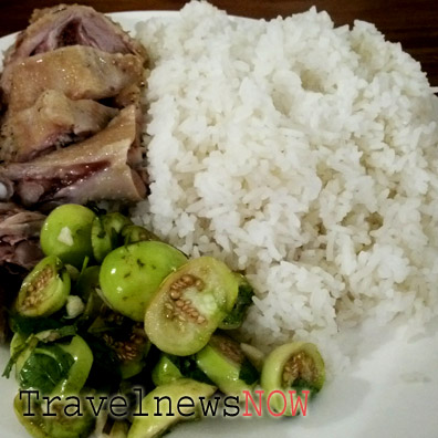 A Vietnamese meal with steamed rice, steamed goose and pickled eggplants