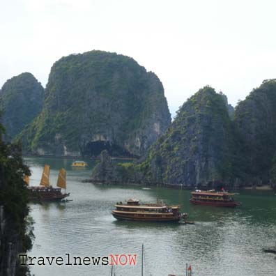 Sail boats at the Bo Nau Cave in Halong Bay Vietnam
