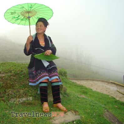 A Black Hmong lady amid wild mountains at Sapa, Lao Cai, Vietnam