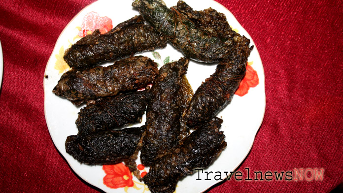 Fried minced pork wrapped in lolot leaves