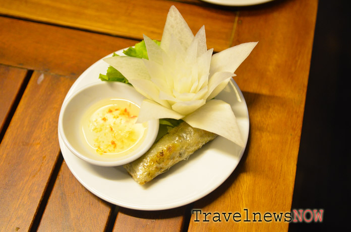 A seafood springroll on board