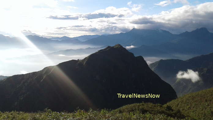 Stunning clouds-crested mountain peaks on the trekking tour to Mount Ky Quan San (Bach Moc Luong Tu)